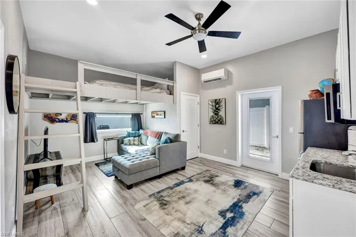 "Tiny home" concept addition complete with fridge, microwave, sink and washer/dryer combo.