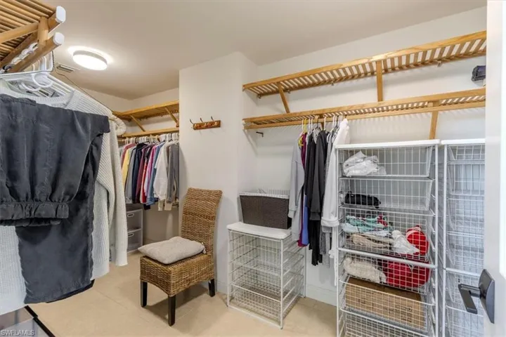 Master Bedroom Walk In closet with wooden shelving