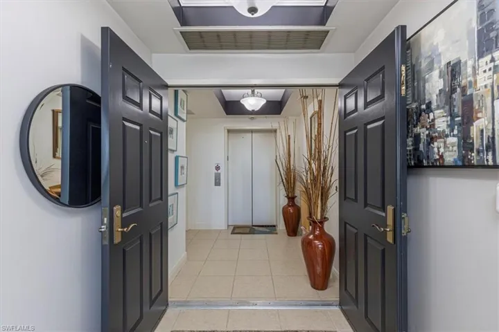 Foyer entrance featuring private elevator access