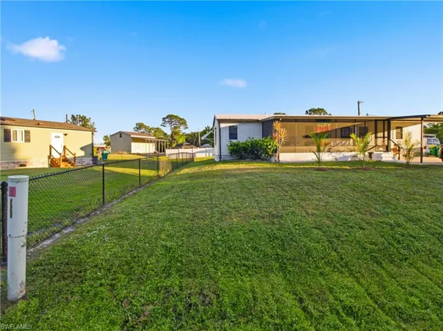 View of fenced backyard