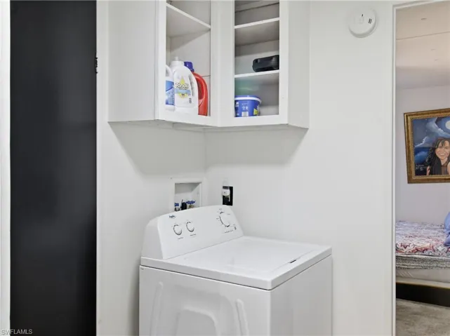 Washroom with washer / clothes dryer