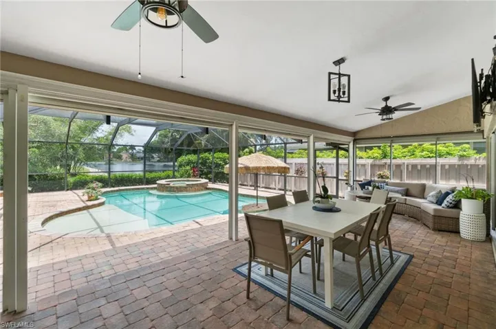 Large screened-in lanai with abundant covered space perfect for the upcoming Summer days!