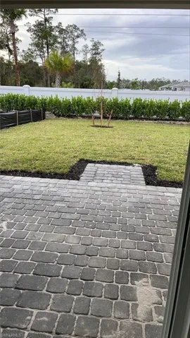 Backyard view underneath covered lanai