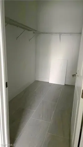 Huge, primary bedroom walk-in closet