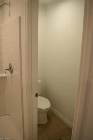 Bathroom with baseboards and walk in shower