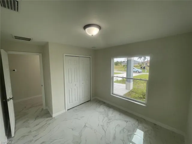 Unfurnished bedroom featuring a closet