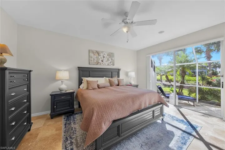 Master bedroom w/plenty of ight from sliders