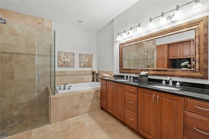 Master en-suite bath with dual vanities, large soaking tub