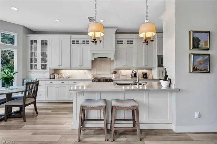 Prepare your favorite meals while chatting with guests.  State of the art appliances, gorgeous cabinets, quartz and backsplash!