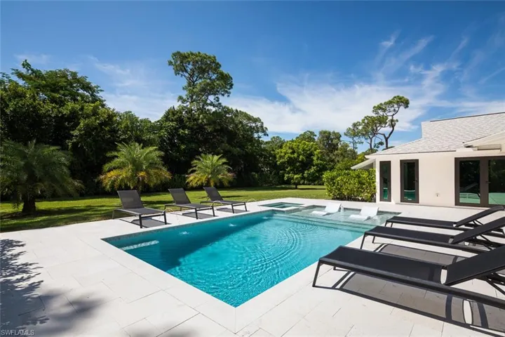 View of swimming pool featuring a yard and a patio area
