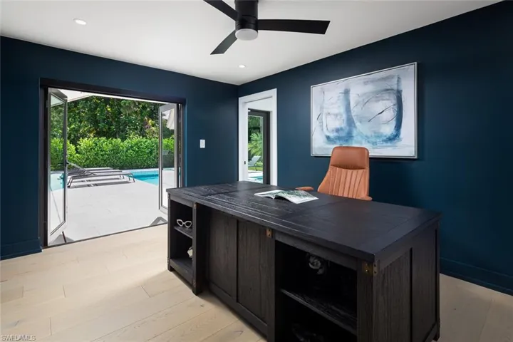 Office area featuring ceiling fan and light hardwood / wood-style flooring