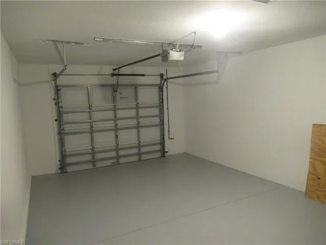 Garage featuring a garage door opener