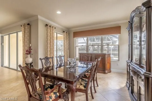 Tiled dining room with crown molding