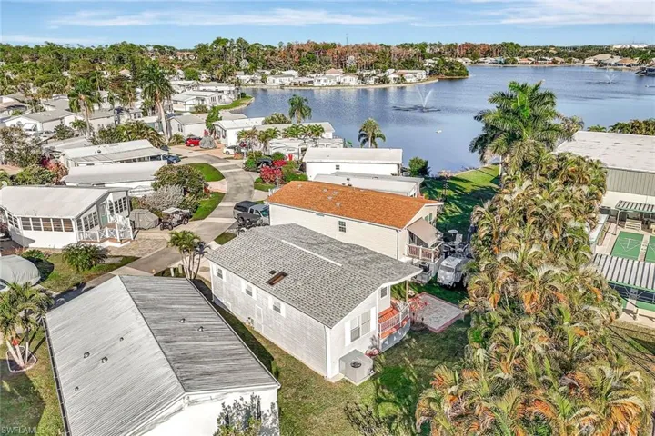Aerial perspective of suburban area with a large body of water