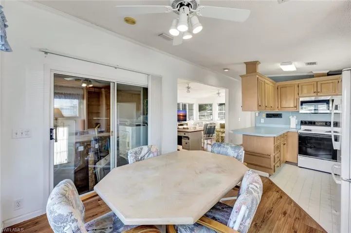 Dining room featuring healthy amount of natural light and light wood-type flooring