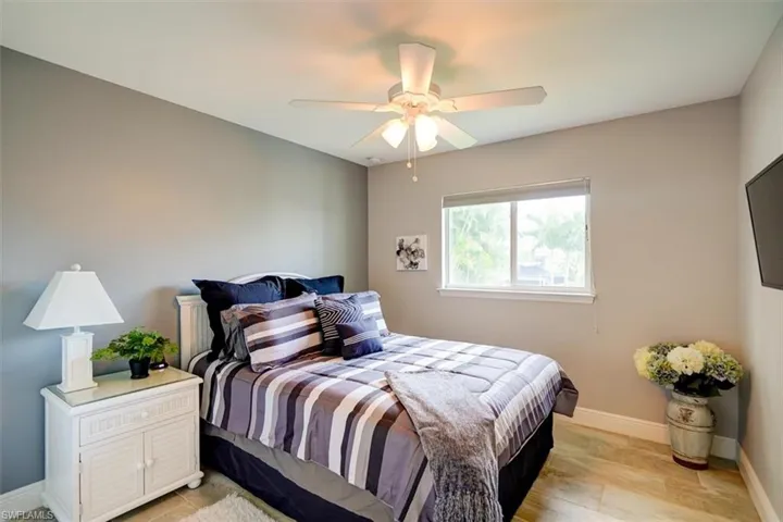 Bedroom with light wood-type flooring and ceiling fan