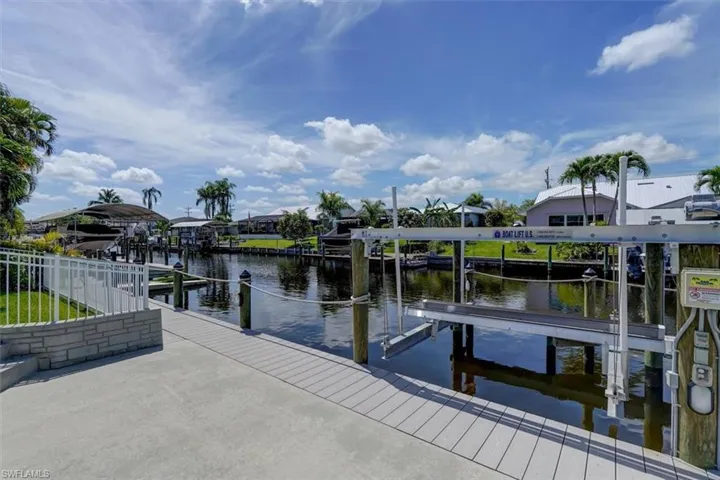 Dock area featuring a water view