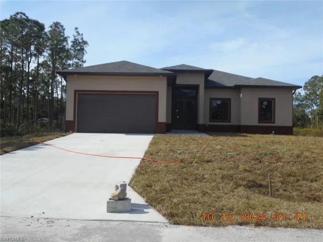 Prairie-style home featuring a garage