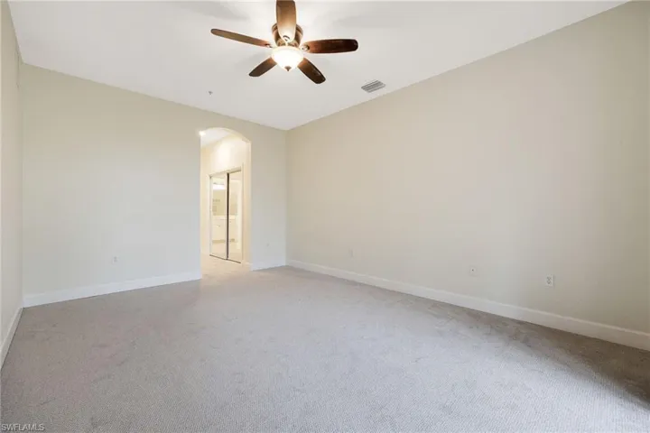 Unfurnished room featuring ceiling fan