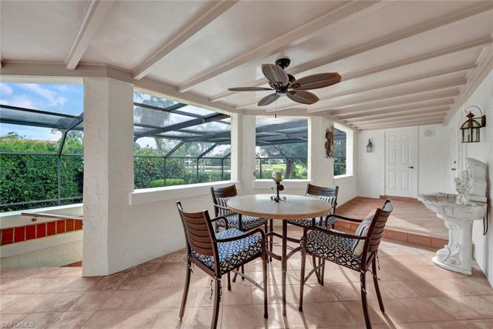 Verandah Porch (under truss) Wood Ceiling, Mexican Tile, Door to Pool Bath