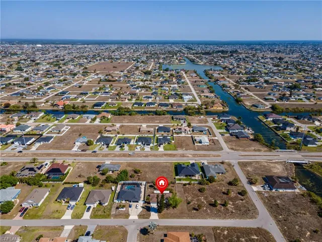 View of property location with nearby suburban area and a large body of water