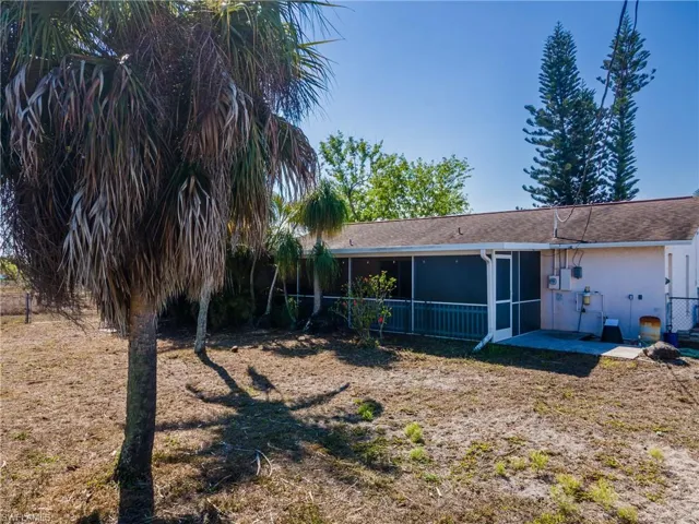 Back of property featuring a sunroom