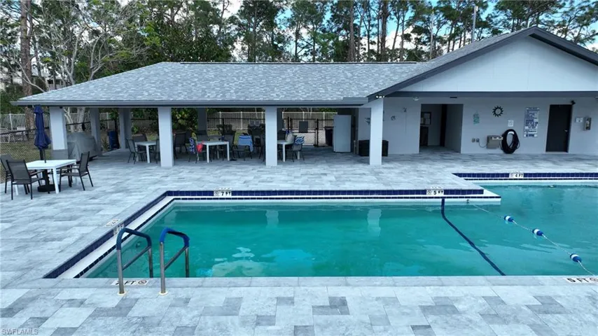 Community pool with a patio area