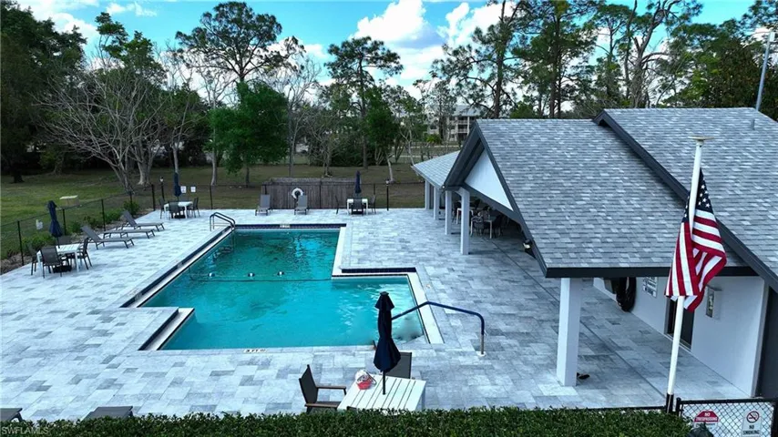 Community pool with a patio area
