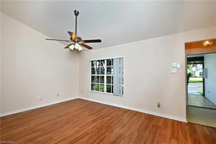 Empty room featuring wood finished floors and ceiling fan