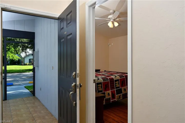 Foyer entrance featuring a ceiling fan