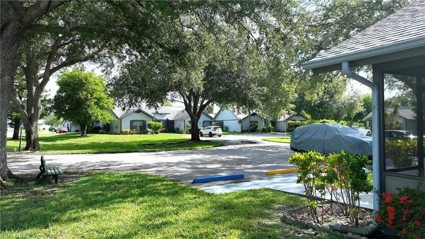 View of green lawn featuring a residential view