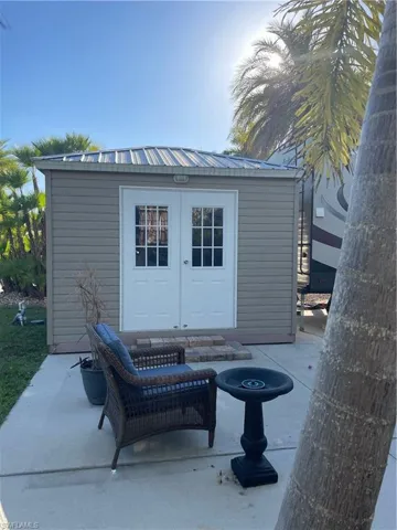 View of patio featuring an outbuilding