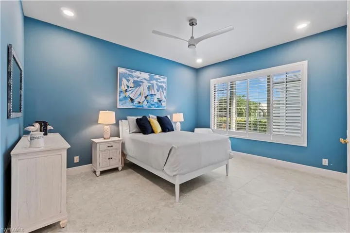 Third bedroom with Porcelain tiles throughout, high ceilings, plantation shutters and En suite bath.