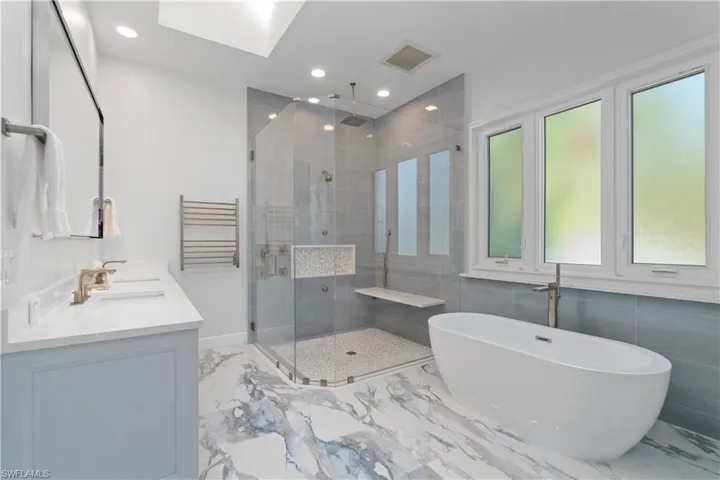 Double sinks, separate water closet, towel warmer