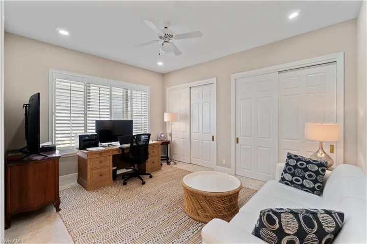 Second bedroom with double closet solid wood doors, plantation shutters and en suite access.
