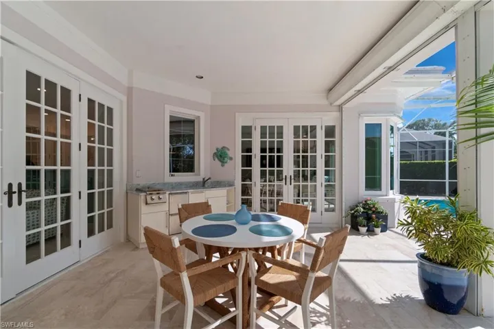 Fabulous outdoor space with a Grill, Refrigerator drawers, a sink with a garbage disposal .