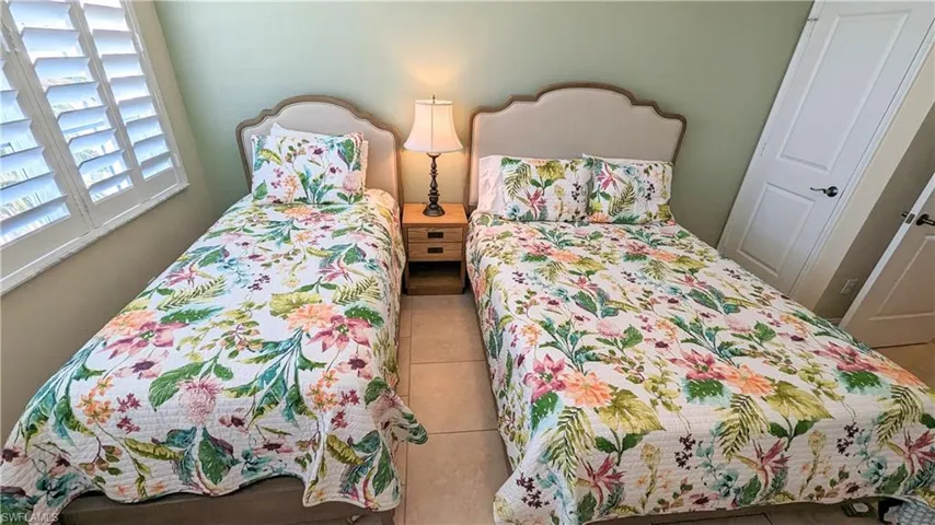 Guest bedroom with a twin bed and a full bed