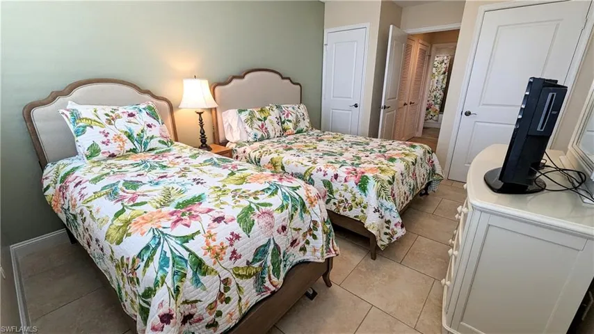 Guest bedroom with a twin bed and a full bed