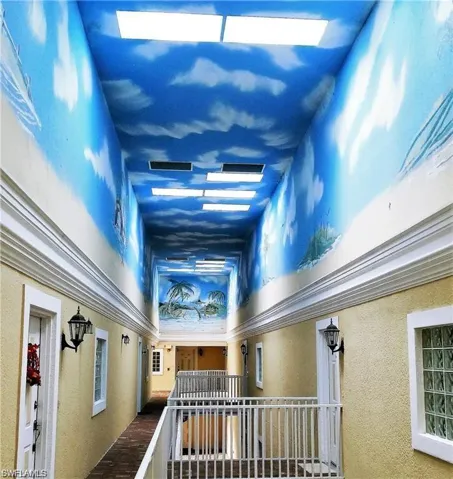 Hallway featuring a textured wall