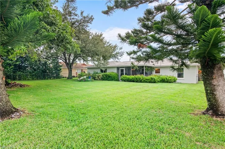 View of yard with a sunroom