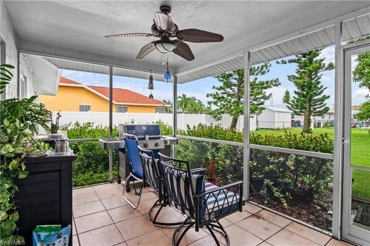 Sunroom / solarium with a ceiling fan