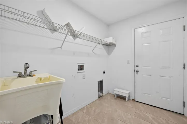 Laundry area featuring washer hookup and electric dryer hookup