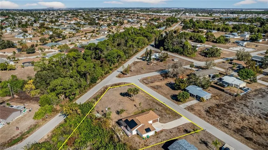 Aerial view of residential area with property parcel outlined