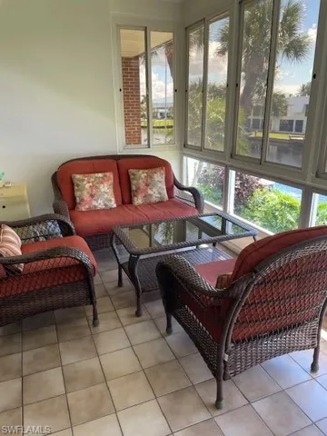 Sunroom featuring tile patterned flooring