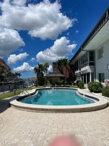Community pool featuring a gazebo and a patio area