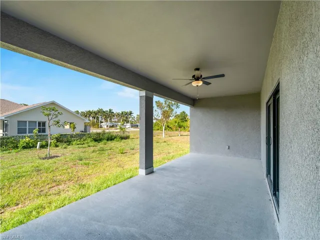 View of patio featuring ceiling fan