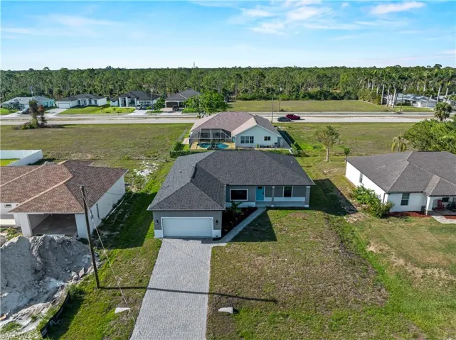 Aerial perspective of suburban area with a heavily wooded area