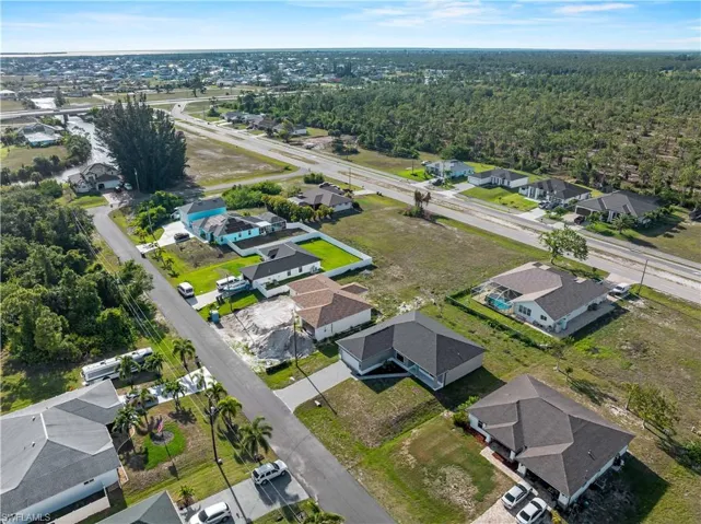 Aerial overview of property's location with nearby suburban area