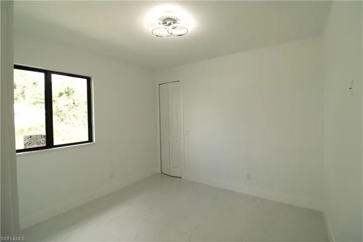 View of tiled spare room