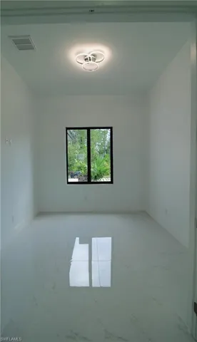 View of tiled spare room